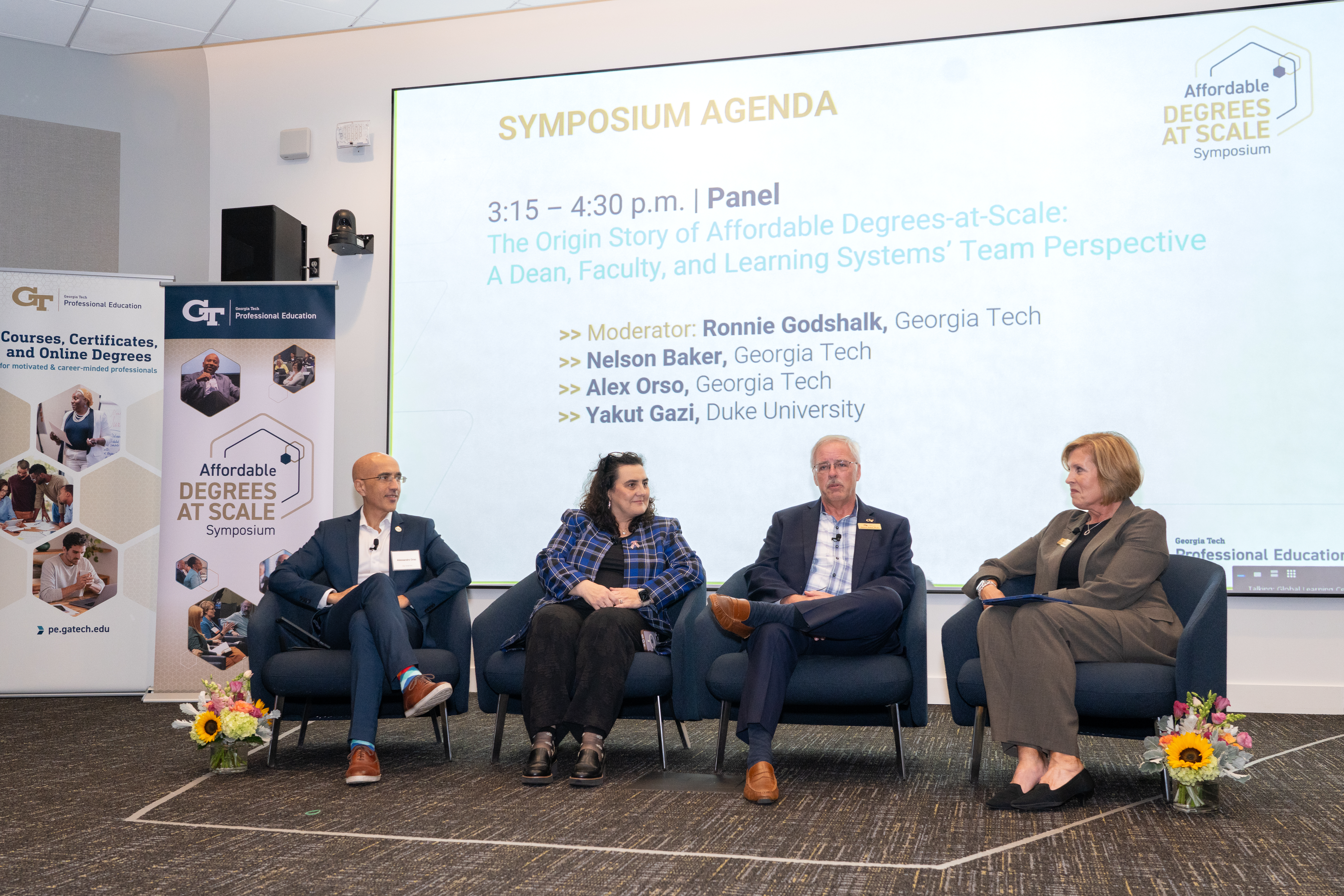 Symposium Co-Chair Ronnie Godshalk (far right) speaks with panelists at the 2024 Affordable Degrees-at-Scale Symposium